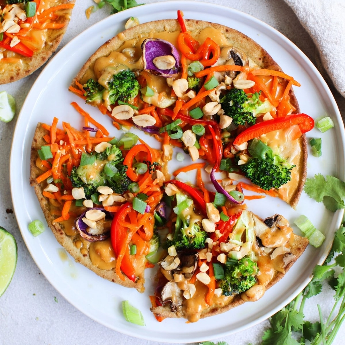 Close-up of Thai Curry Veggie Pita Pizzas, showcasing vibrant vegetable toppings and melted cheese.
