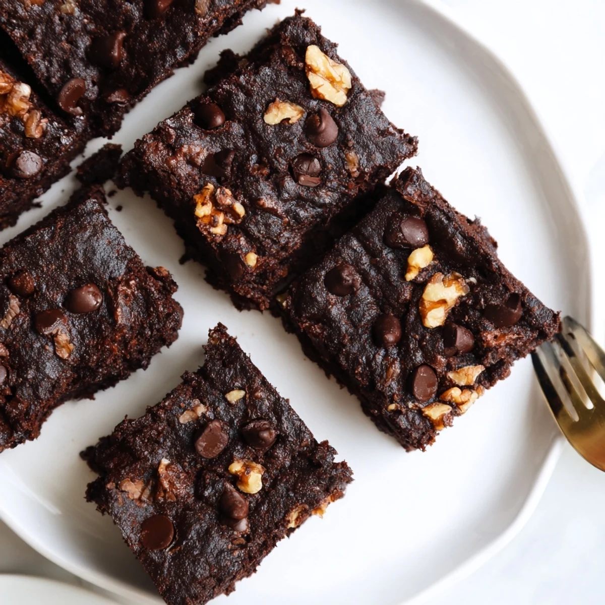 Rich Zero-Waste brownies topped with chocolate chips, perfect for eco-conscious dessert lovers.  