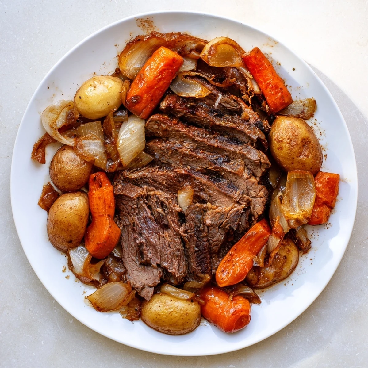 A close-up of a steaming Sunday Pot Roast, showcasing juicy beef with carrots and potatoes.