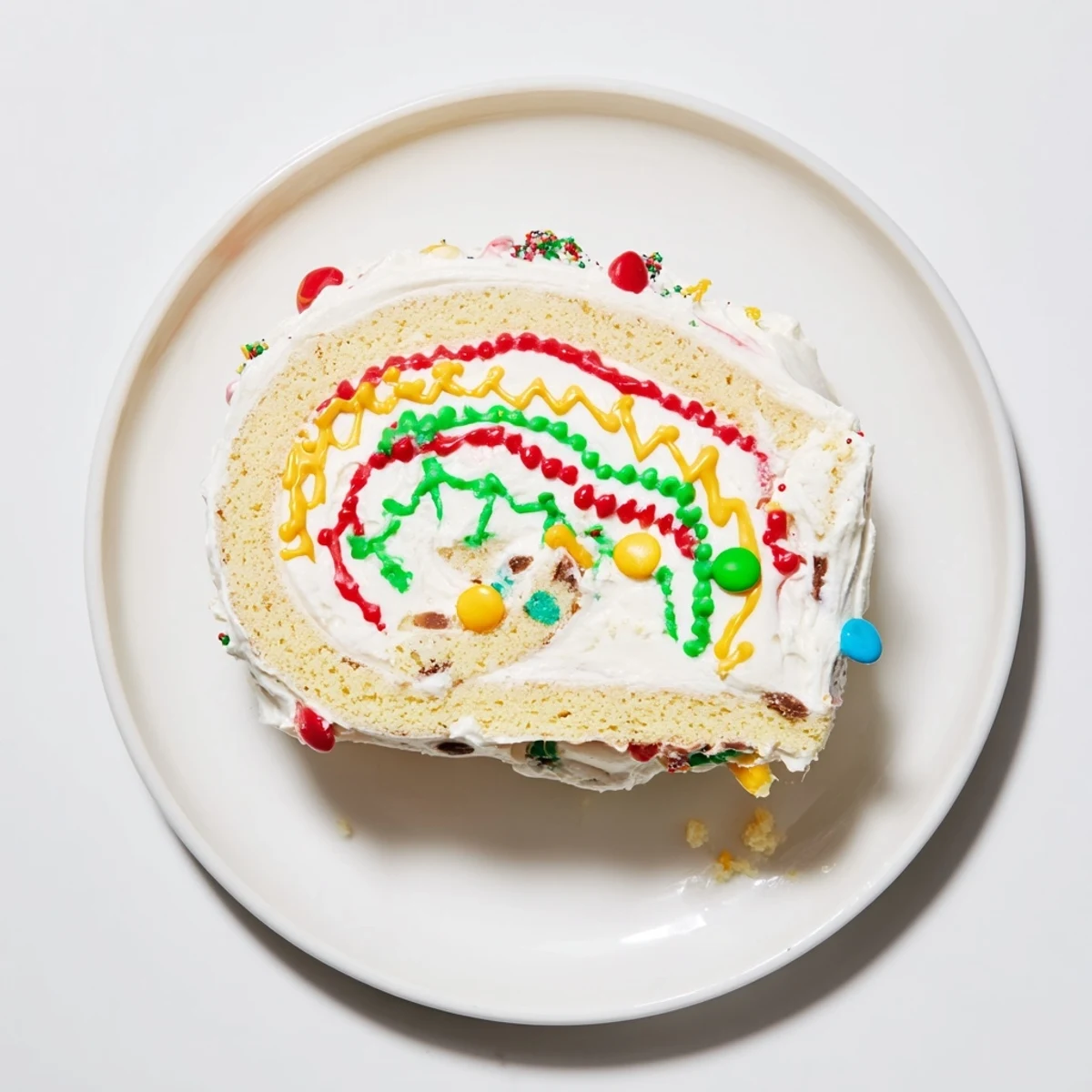 Festive Ugly Sweater Cake Roll showing colorful frosting details and sprinkles on a delicious dessert.