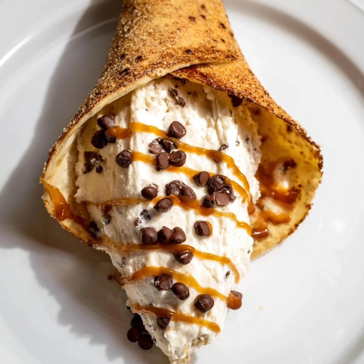 Crispy churro cones filled with creamy cheesecake, a perfect sweet treat for any occasion.