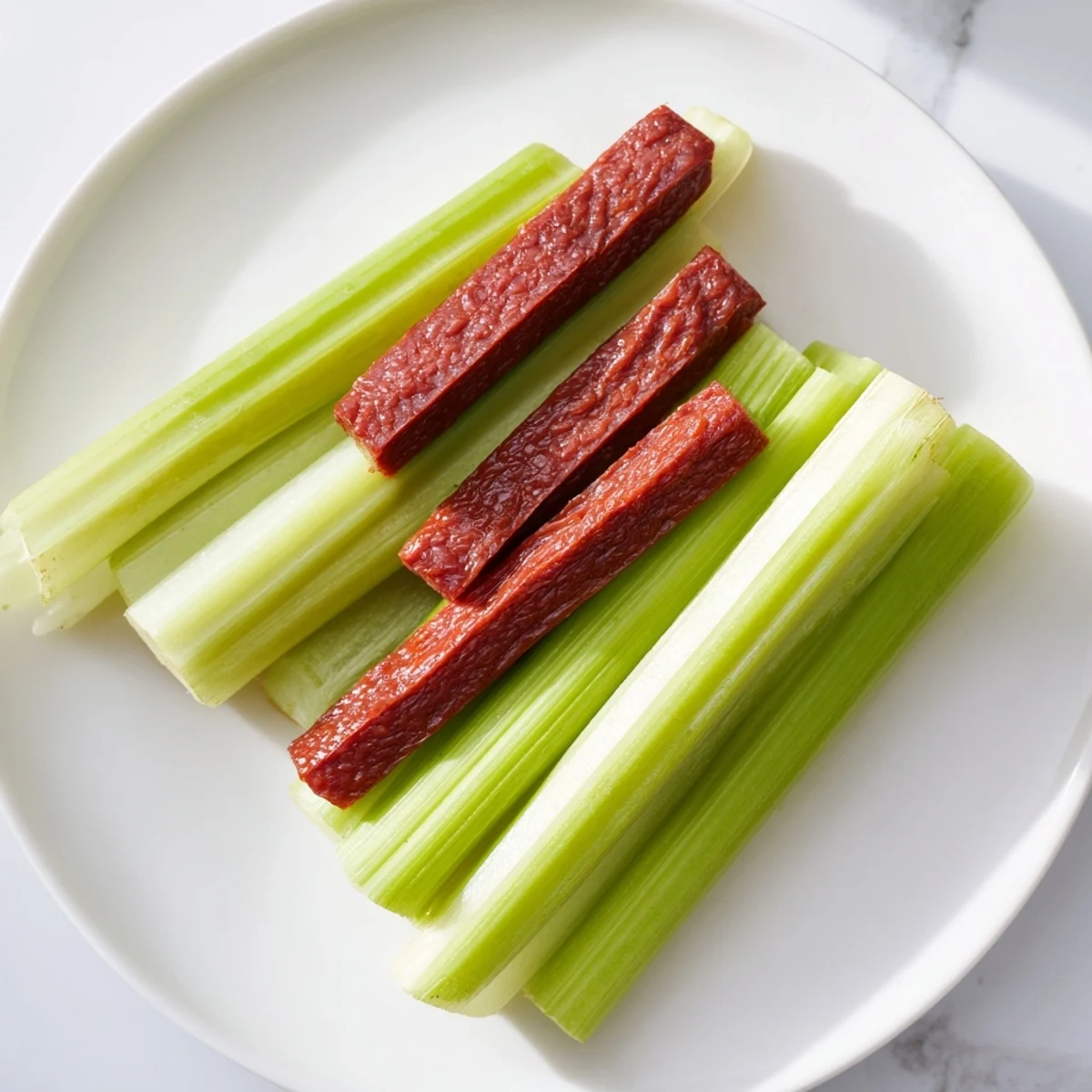 Enjoy this gorgeous Rustic Wheel, a vibrant appetizer with celery and savory meat sticks ready for dipping.