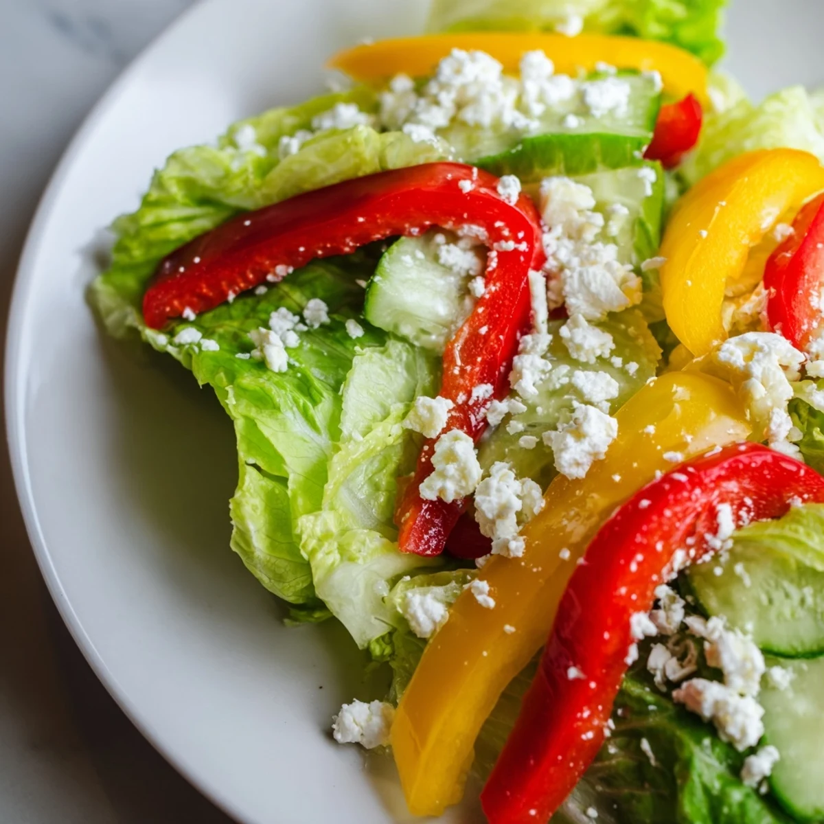 A bright, colorful Bella Hadid Salad brimming with fresh veggies and creamy feta, ready to enjoy.