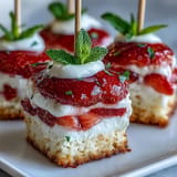 Sweet shortcake, fresh strawberries, and cream on skewers for easy enjoyment.