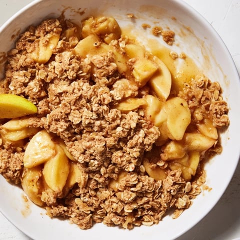 Golden, bubbly Apple Crisp with oat topping, perfect warm with vanilla ice cream.