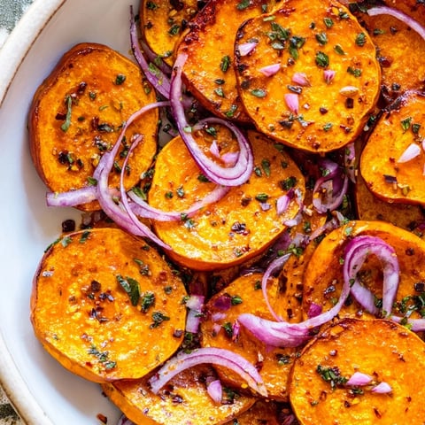Roasted Pumpkin Lantern Halloween Plate, featuring colorful roasted vegetables and a tasty smile.