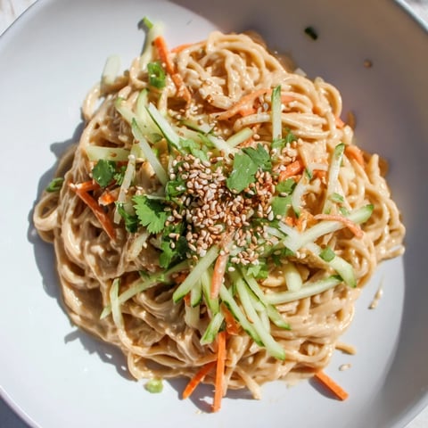 Cold Sesame Noodles: a vibrant bowl of cold noodles with a creamy sesame sauce and fresh veggies.