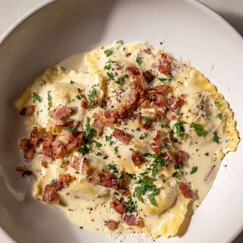 Creamy Olive Garden Ravioli Carbonara, garnished with fresh parsley and Parmesan cheese, looks utterly delicious.