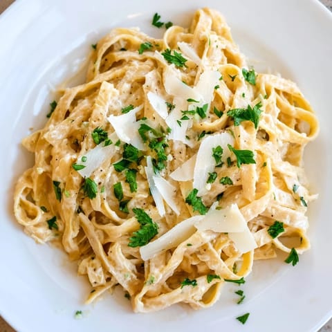 Creamy Skinny Alfredo Garlic Parmesan Snowy Pasta, a healthier Italian comfort food dish.