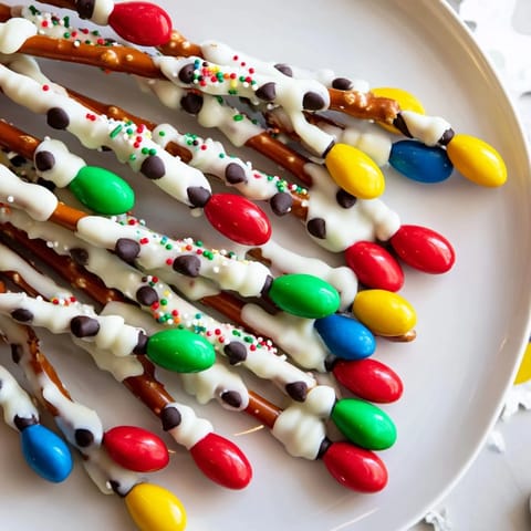 Festive Christmas lights: colorful melted candy decorates these vibrant pretzel sticks for a no-bake treat.