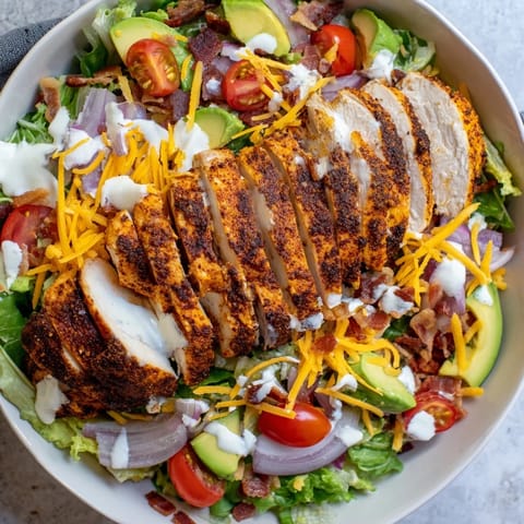 This hearty Crispy Bacon Chicken Salad showcases golden bacon, sliced chicken, and creamy ranch dressing on fresh greens.