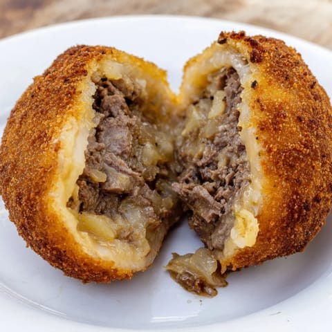 Homemade Dutch croquettes, fried to a perfect golden hue, ready to be served hot with mustard.