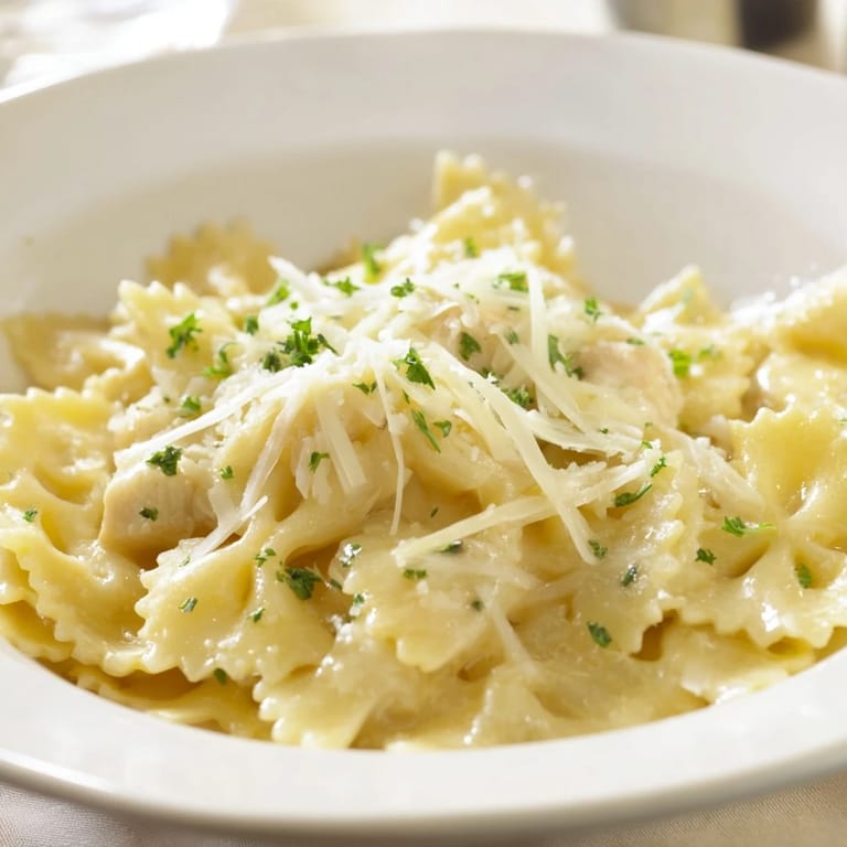 A close-up of cheesy mozzarella garlic butter chicken bowties, ready to be enjoyed as a hearty meal.