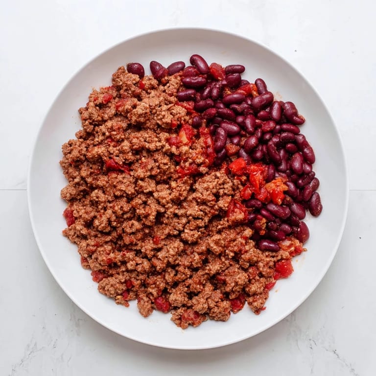 A close-up of the delicious Secret 4-Ingredient Slow Cooker Chili, ready to be topped and devoured.