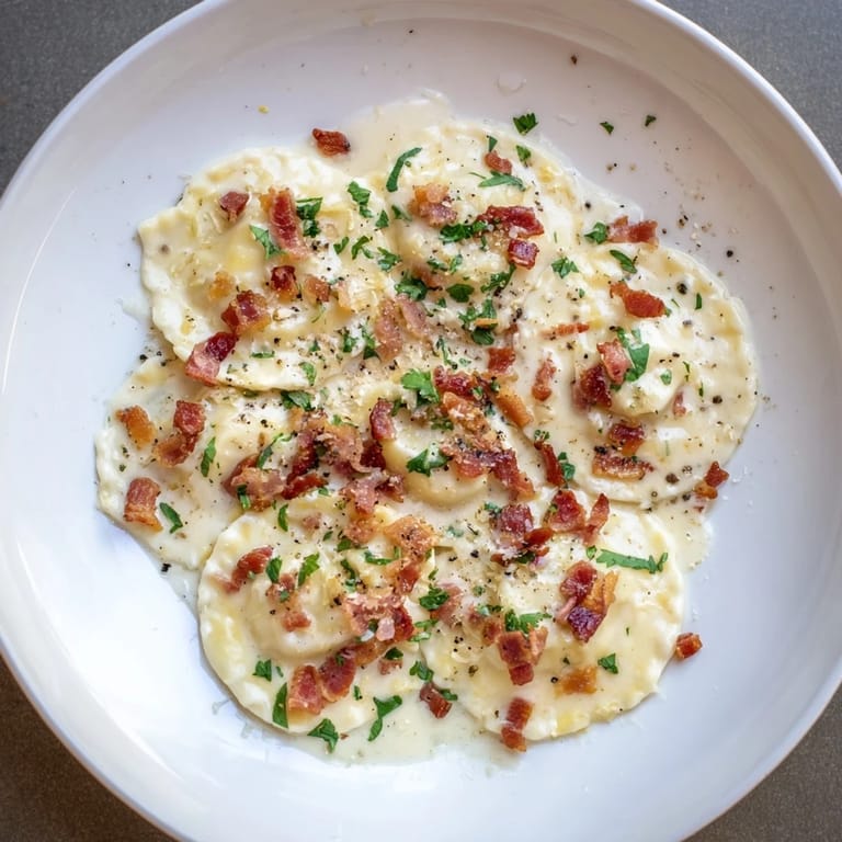 A flavorful dish of Olive Garden Ravioli Carbonara, showcasing perfectly cooked ravioli and savory pancetta.