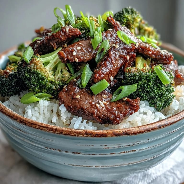Freshly steamed broccoli adds crunch to this Beef and Broccoli Bowl, finished with sesame seeds and sliced green onions.