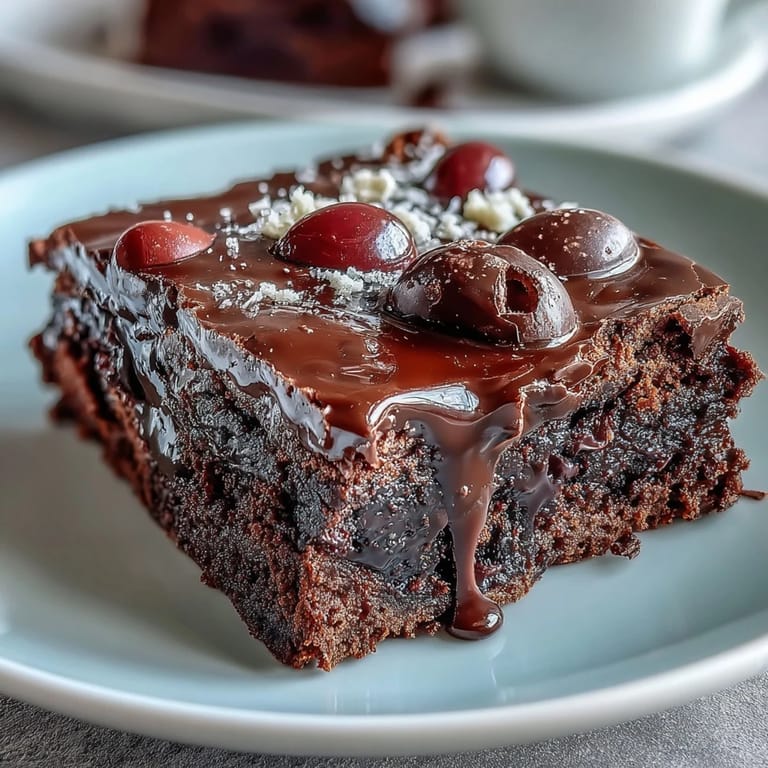 Indulgent Cadbury Egg brownies topped with a golden, crumbly chocolate streusel and candy-coated mini eggs.